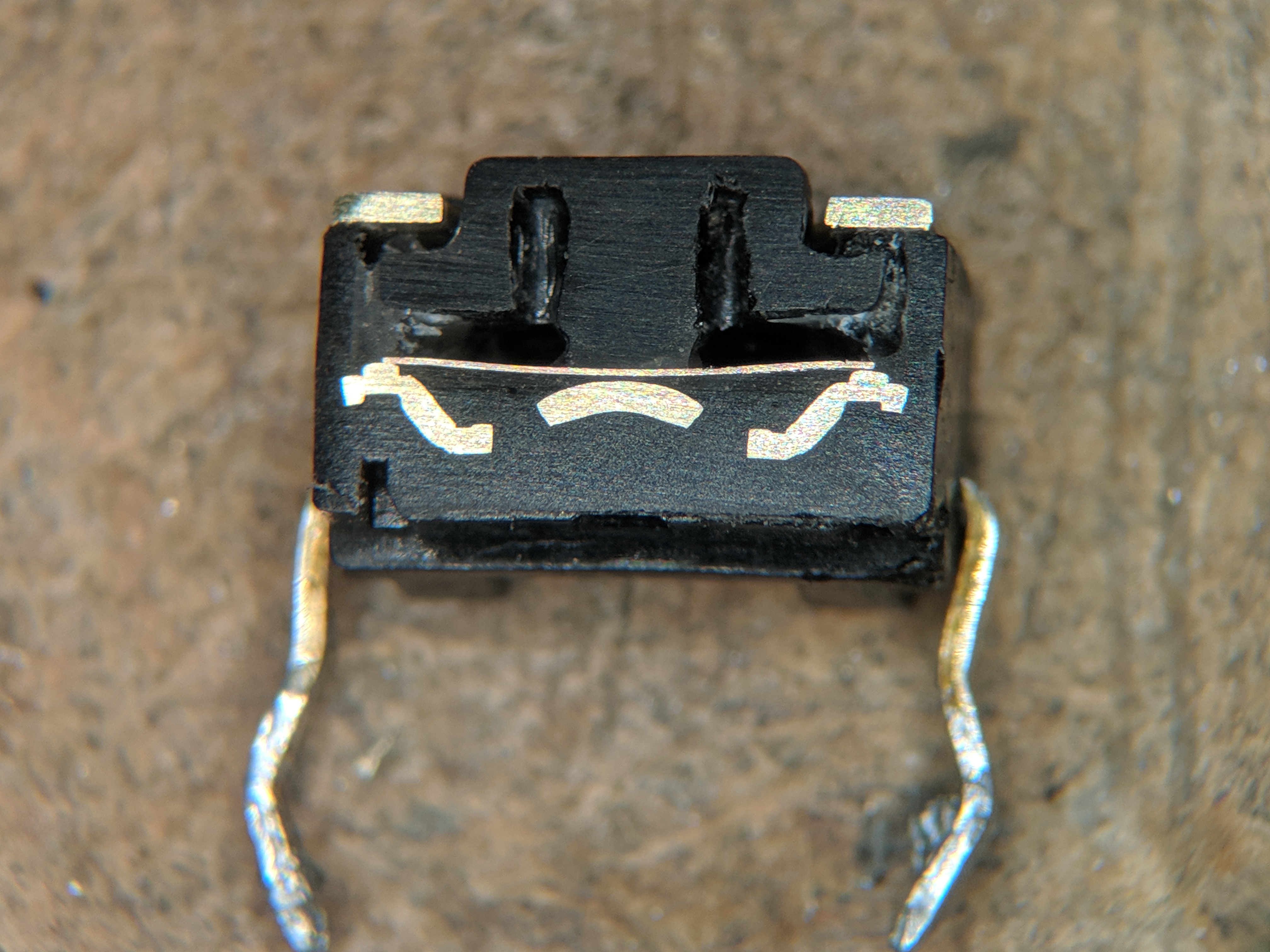 Figure 5 — Cross-section of a 6 × 6 mm tact (tactile) switch — the canonical button used for the D-pad and face-button mod below. The metallic dome under the plastic actuator is what gives the click feel; it …