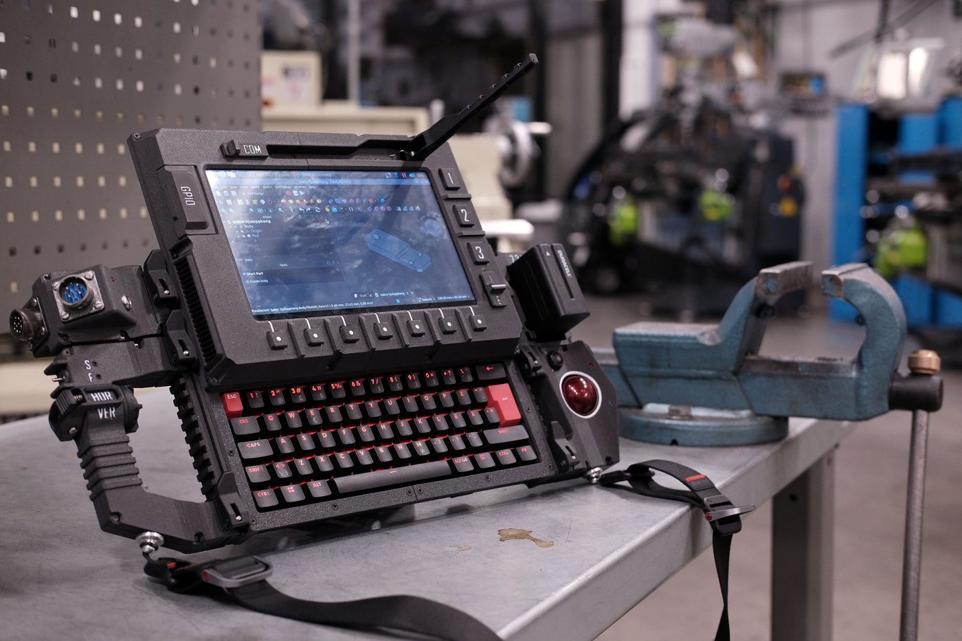 Figure 7 — 7 — The DFCD's control surface — the mechanical keyboard, function buttons, and the side trackball — on the assembled unit. Photo: ArcticEnrichmentCenter, DFCD project repo (github.com/Arc…